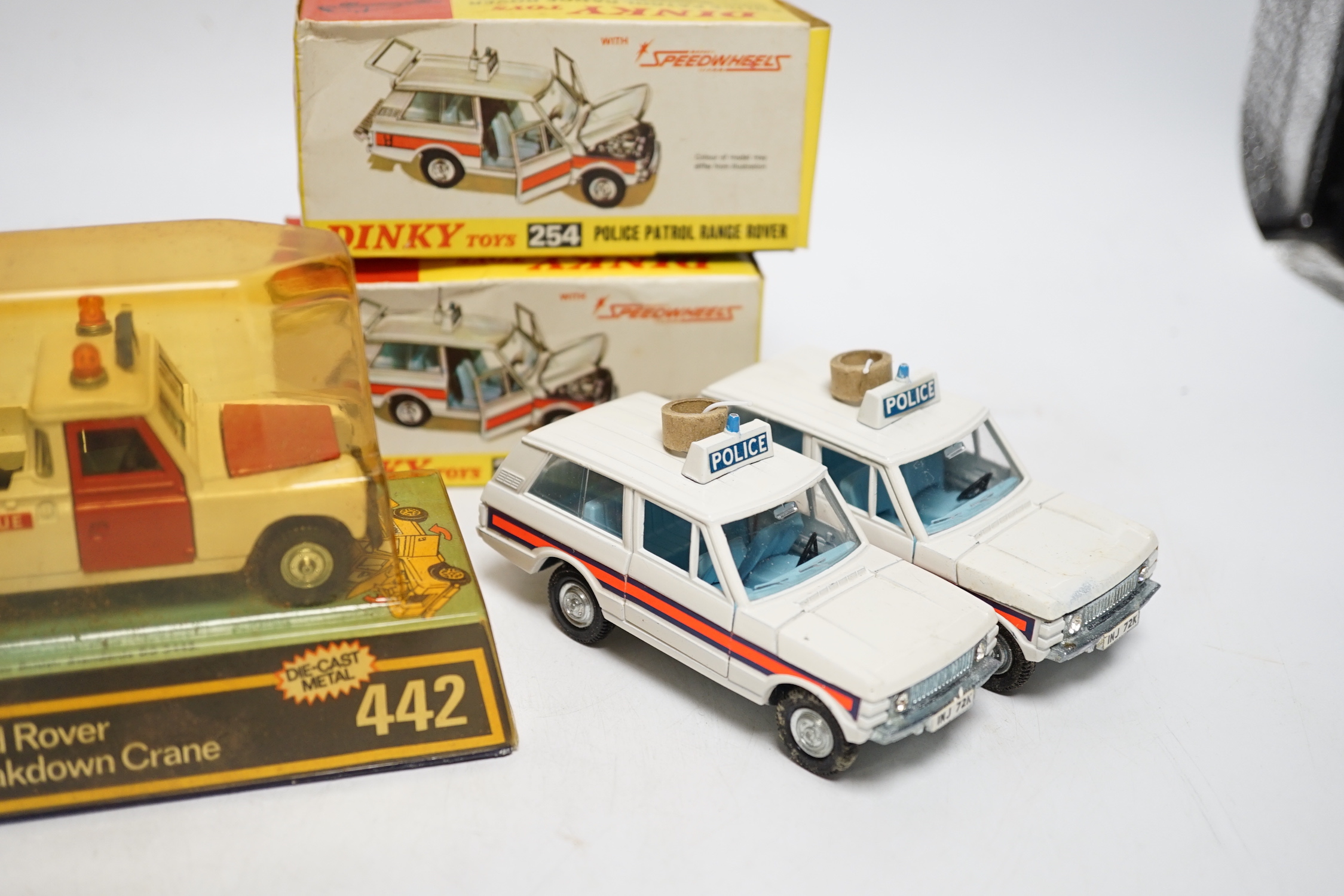Five boxed Dinky Toys; Rover 75 Saloon (156) in correct two-tone green colour spot box, two Police Patrol Range Rover (254) and two Land Rover Breakdown Crane (442)